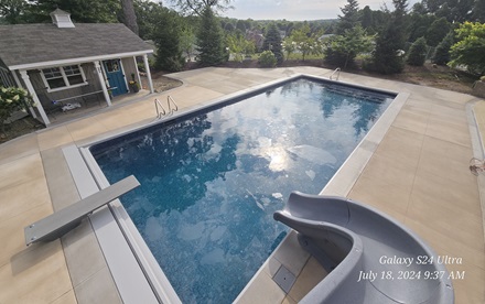 photo of a two tone concrete pool patio